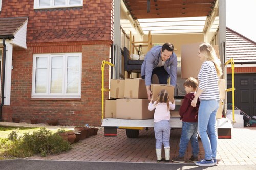 Removal van with moving team supporting a flat or office relocation