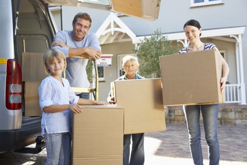 Satisfied customers interacting with professional movers