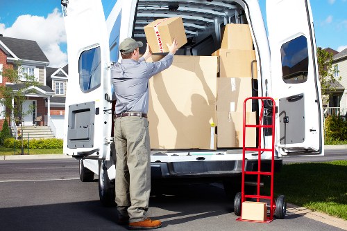 Professional movers loading items into a van near Highbury
