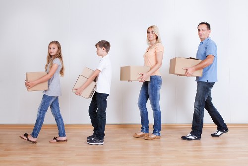 Highbury Removals team securing boxes for transport