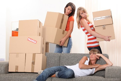 Highbury Removals worker using safety measures while lifting furniture