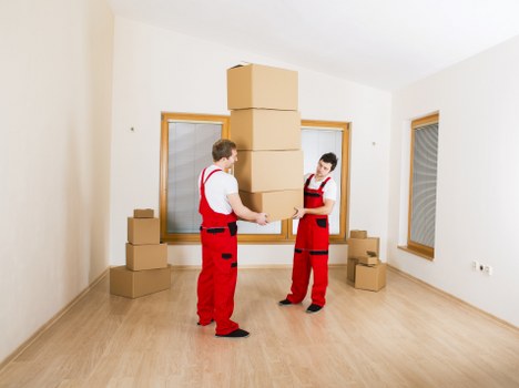 Professional movers loading office equipment during a Highbury office move